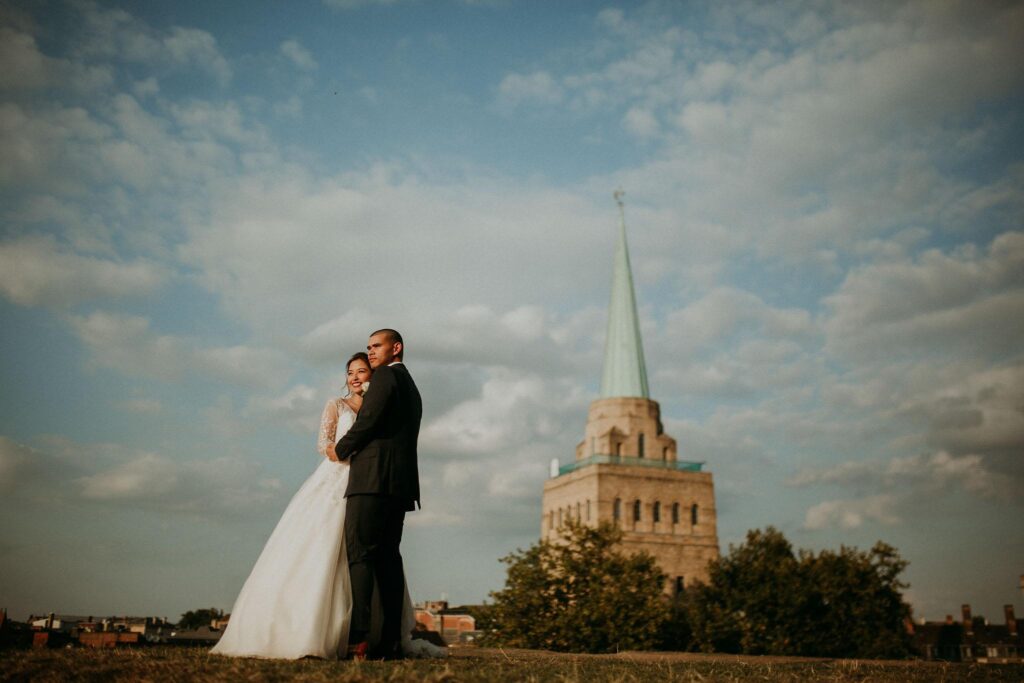 wedding portrait with the st john's college spire in the background