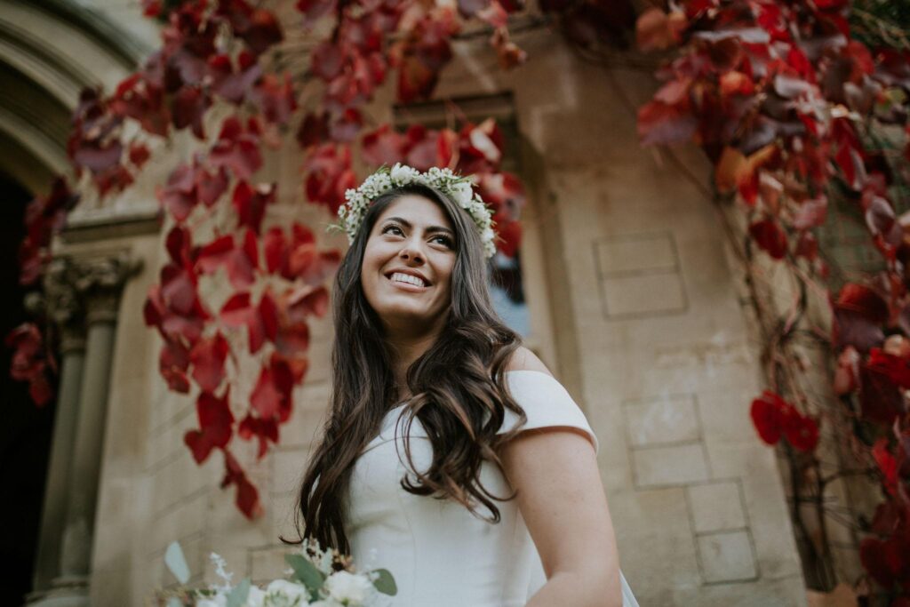 bride portrait in Bailliol College gardens with a red leaves in the backdrop