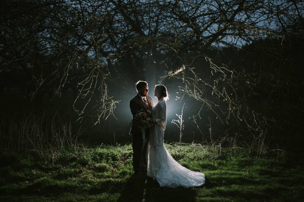 night image of the bride and groom in the apple orchard