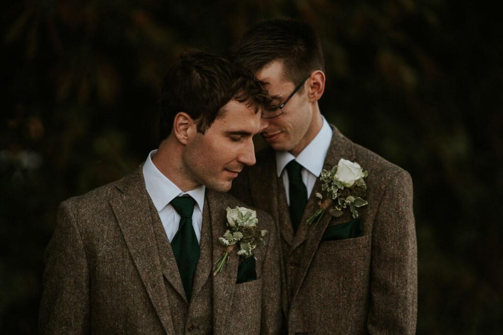 moody portrait of groom and groom