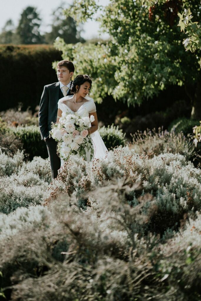 bride and groom in the gardens of Christ Church College in Oxofrd