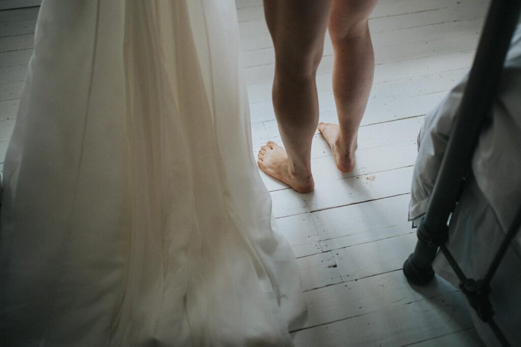 image of bride about to put her wedding dress on