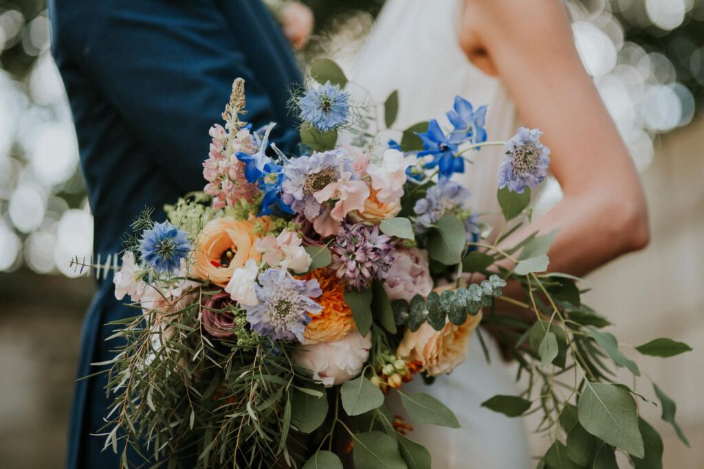a beautiful wedding flower bouquet made of summer meadow flowers